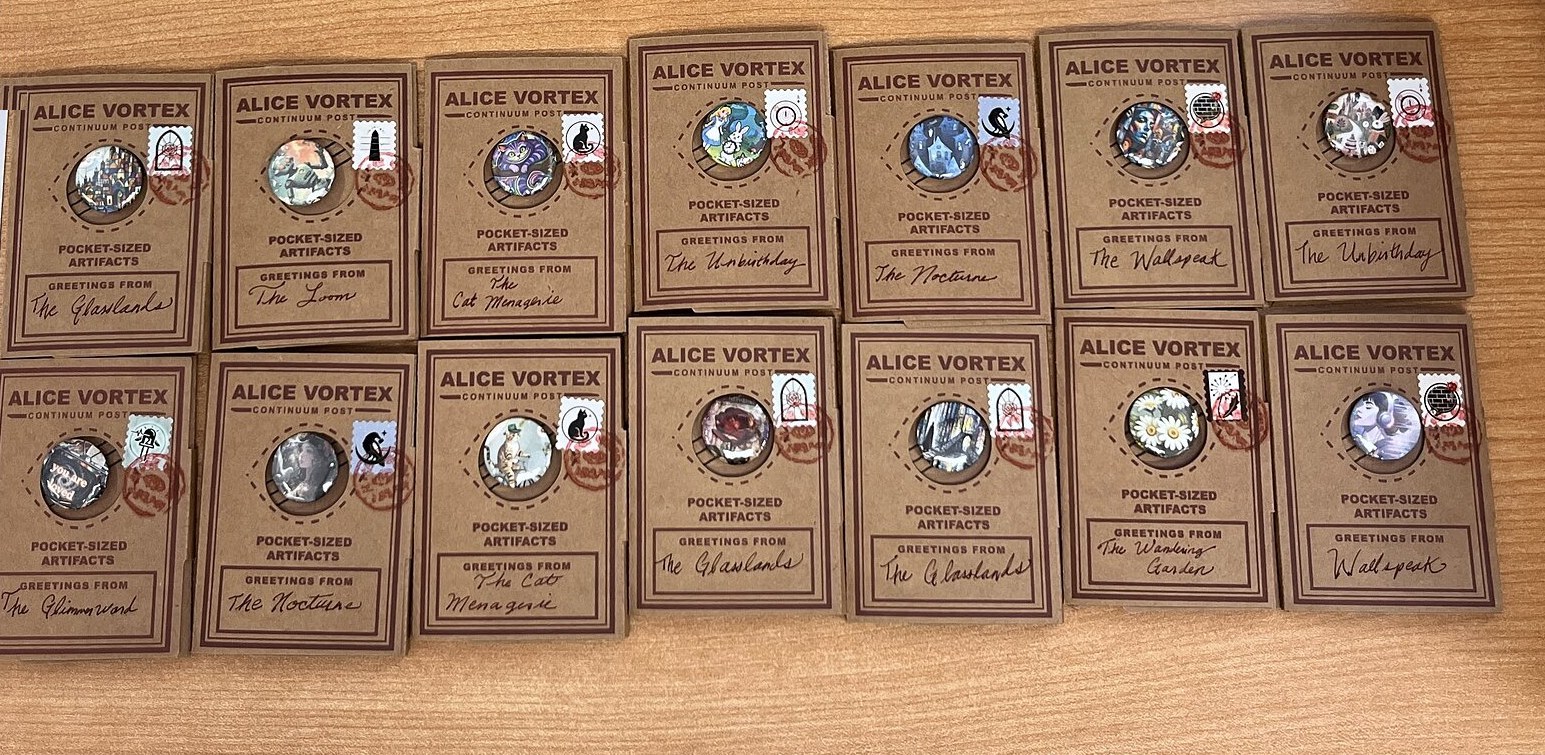 All fourteen Artifact Wallets of the Vortex Atlas laid out whole in two rows on the outpost counter - brass charms, glass windows, and kraft parcels, red cancels riding the stamps, packed by hand.